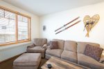 Ski-inspired decor highlights the main living space of the condo.